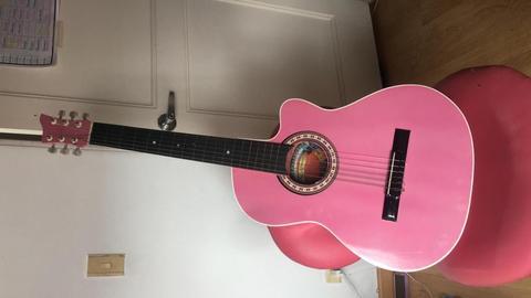 Guitarra color rosado 100000 cel 3118758307