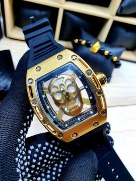 Reloj calavera dorado